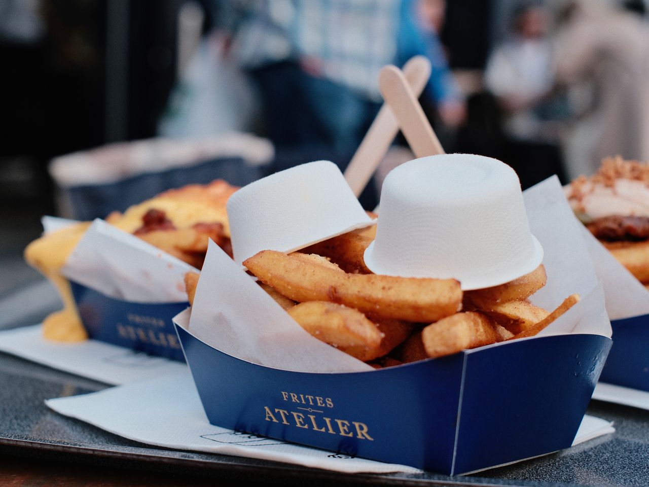 Crispy Belgian fries served at Frites Atelier, an iconic street food spot in Brussels.